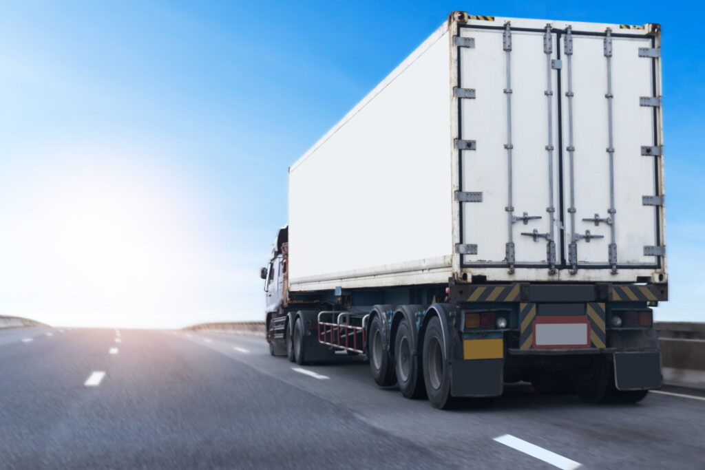 White Truck on highway road with  container, transportation concept.,import,export logistic industrial Transporting Land transport on the asphalt expressway